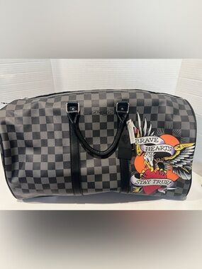Ed Hardy duffel bag features a black and grey checkered pattern